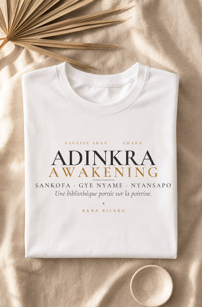 Bana Bilaka Adinkra Awakening — t-shirt blanc coton bio, mise en scène flat-lay premium