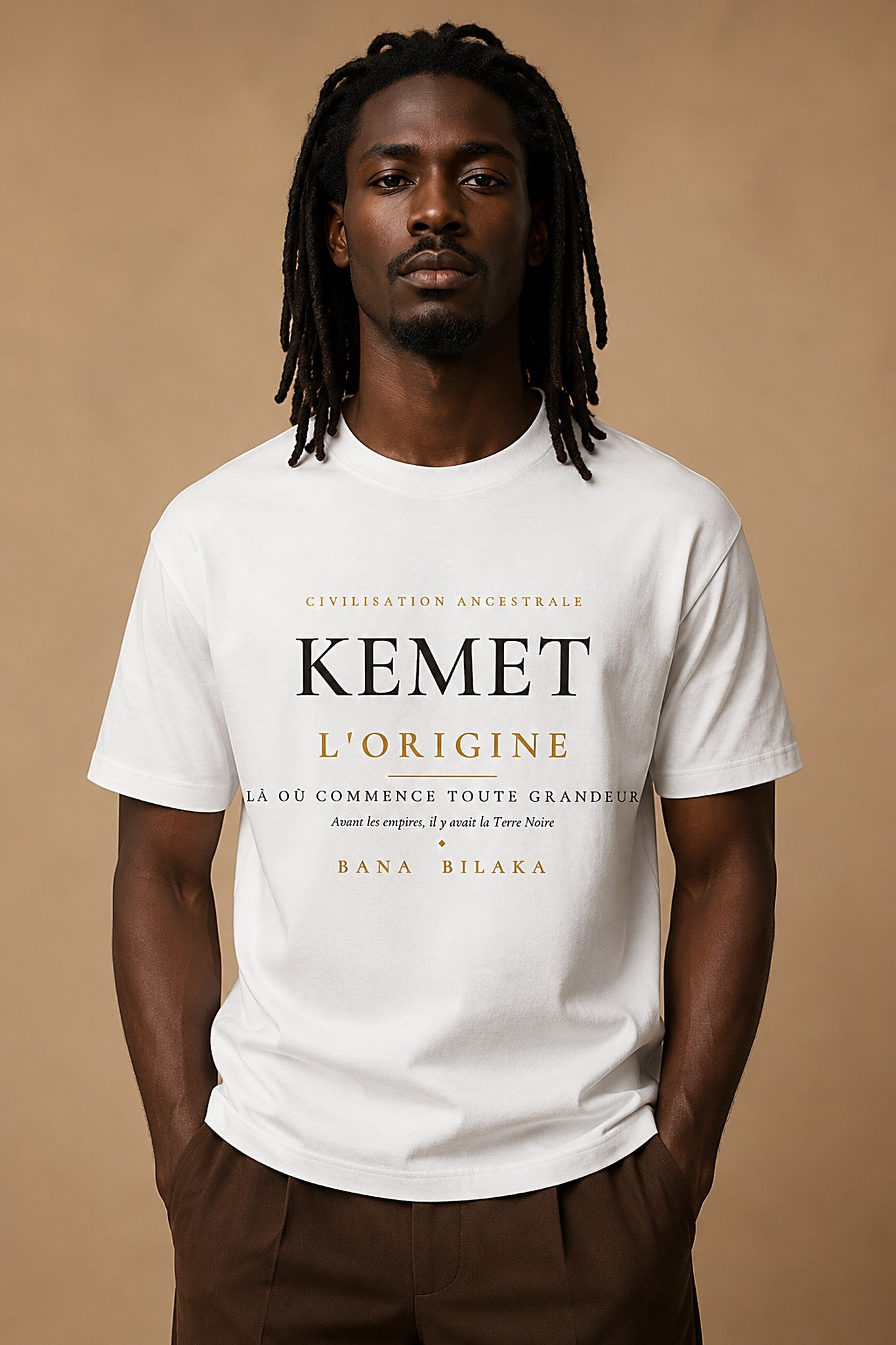 Bana Bilaka Kemet l'Origine — premium white organic cotton men's tee worn by a Black man, editorial portrait