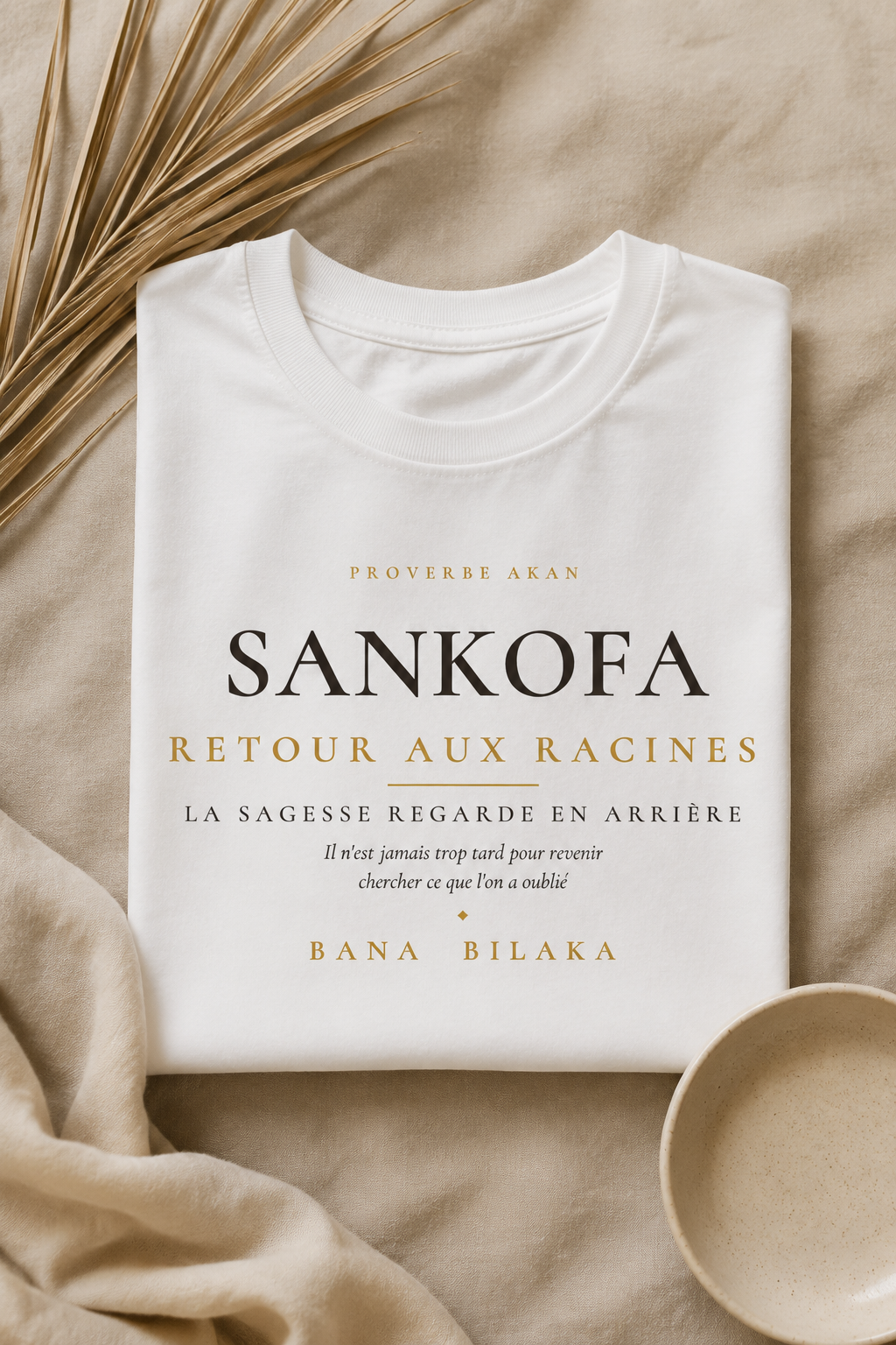 Bana Bilaka Sankofa — t-shirt blanc coton bio, mise en scène flat-lay premium