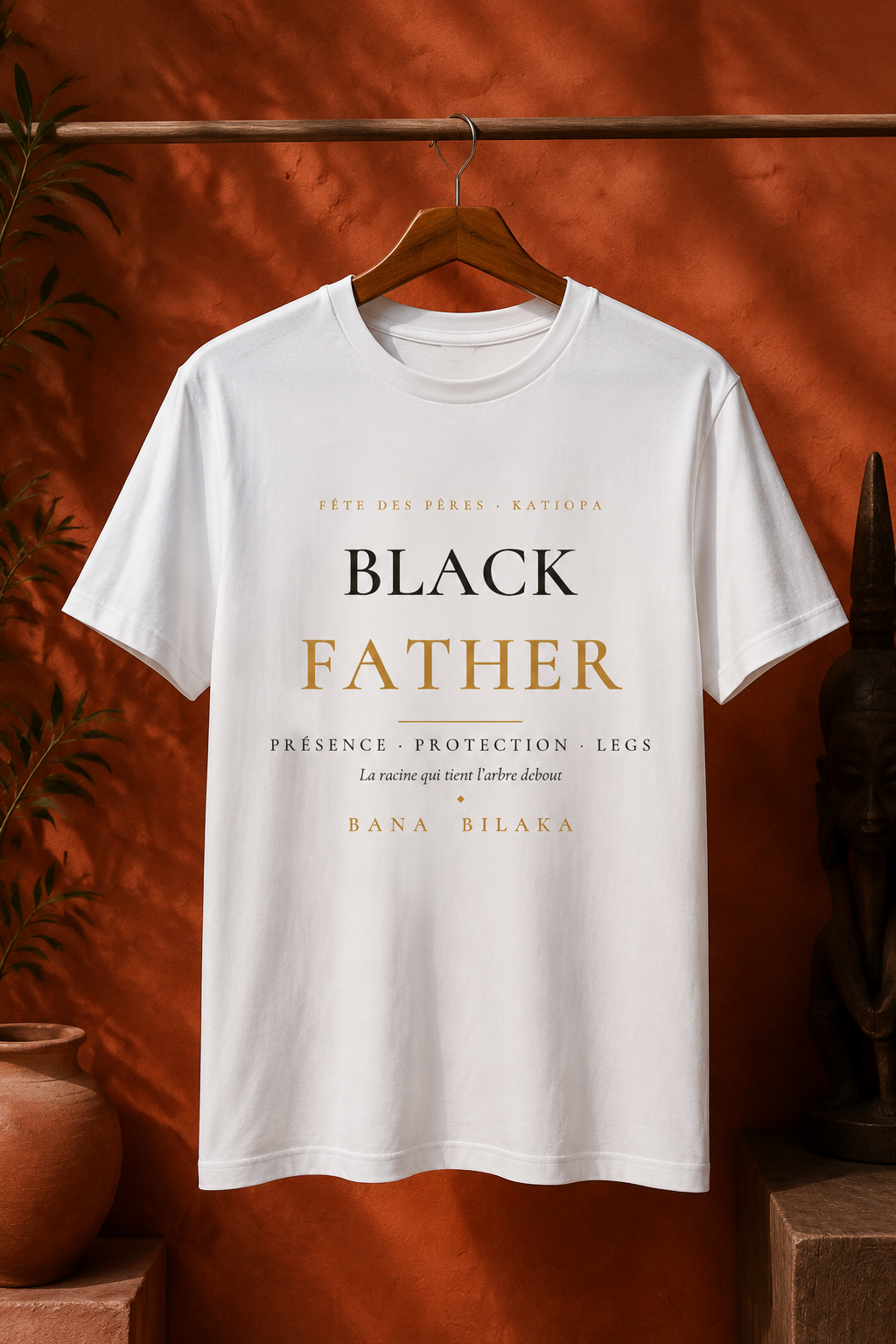 Bana Bilaka Black Father — t-shirt blanc sur cintre, ambiance boutique terracotta