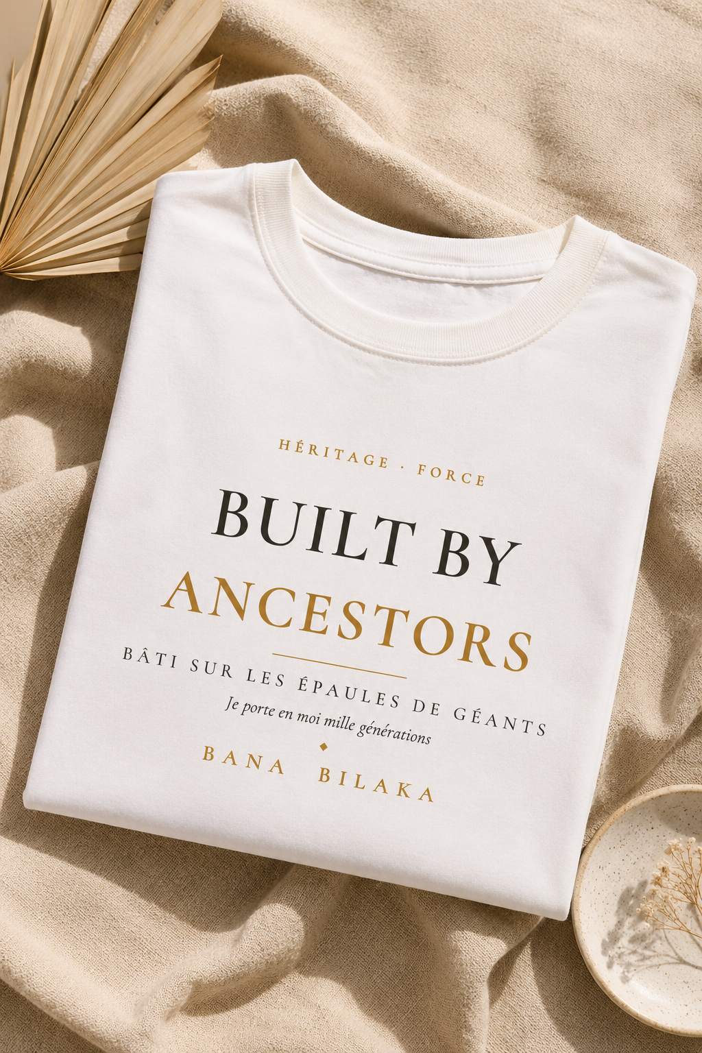 Bana Bilaka Built by Ancestors — t-shirt blanc coton bio, mise en scène flat-lay premium