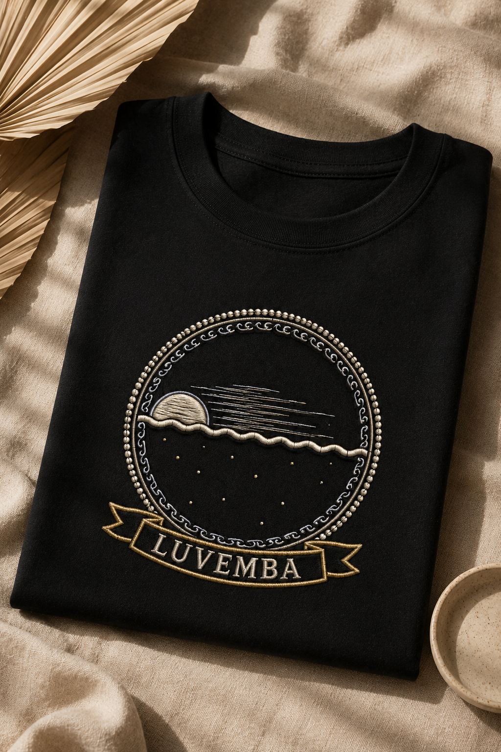 Luvemba black tee flat-lay on linen, Dikenga Collection by Bana Bilaka
