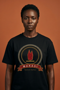 Athletic woman with short natural hair wearing the black Makasi tee, ruby flame over a gold bar, The Twelve Flames collection by Bana Bilaka