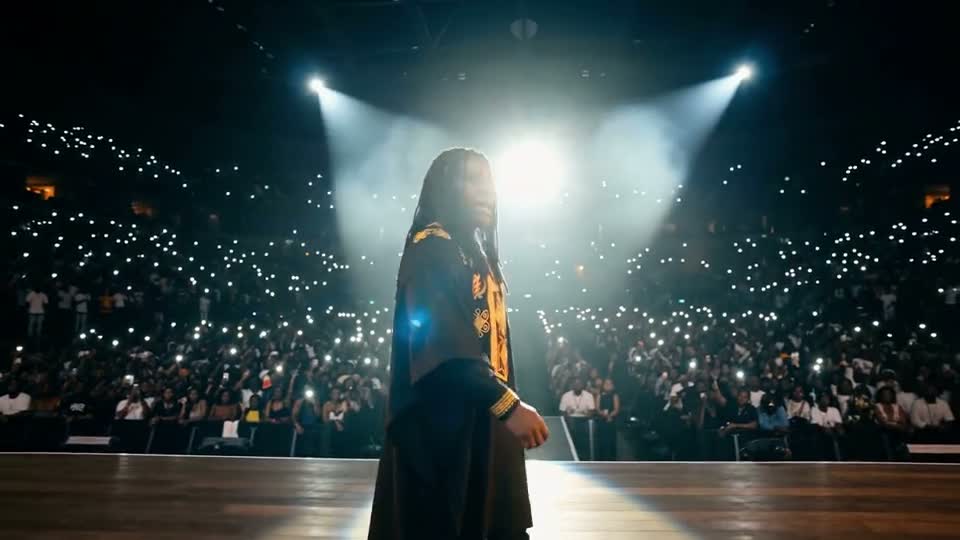 Singer on the runway in front of twenty thousand raised phones, Quiet Crown